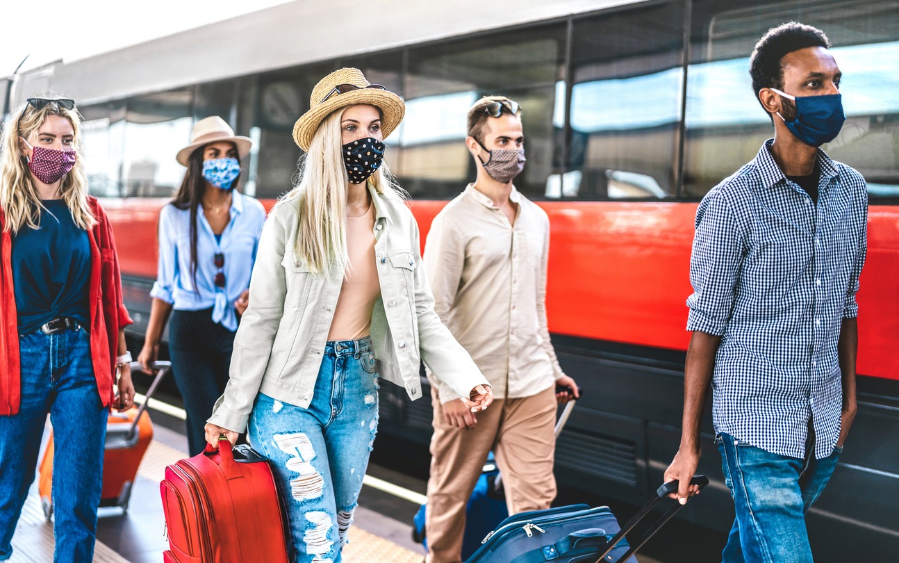 A group of friends boarding on a train