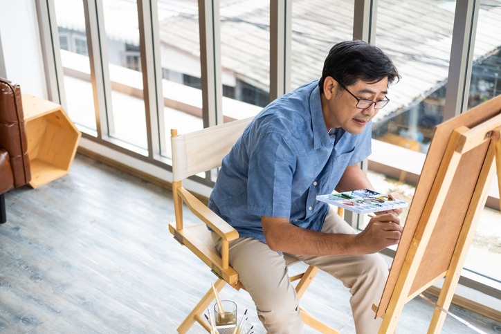 A senior guy painting