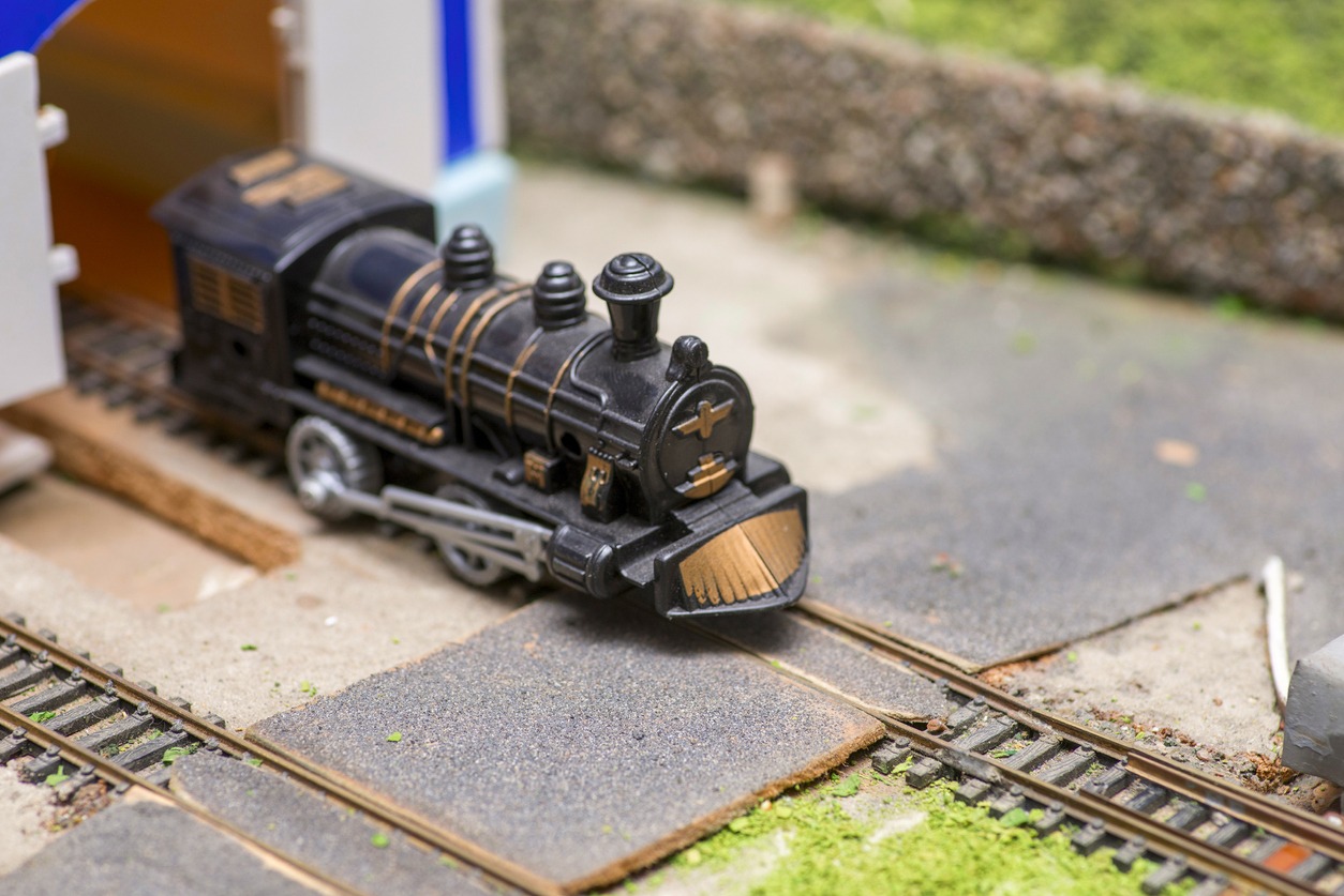Railway modelling. Close-up about model train on the rail tracks.