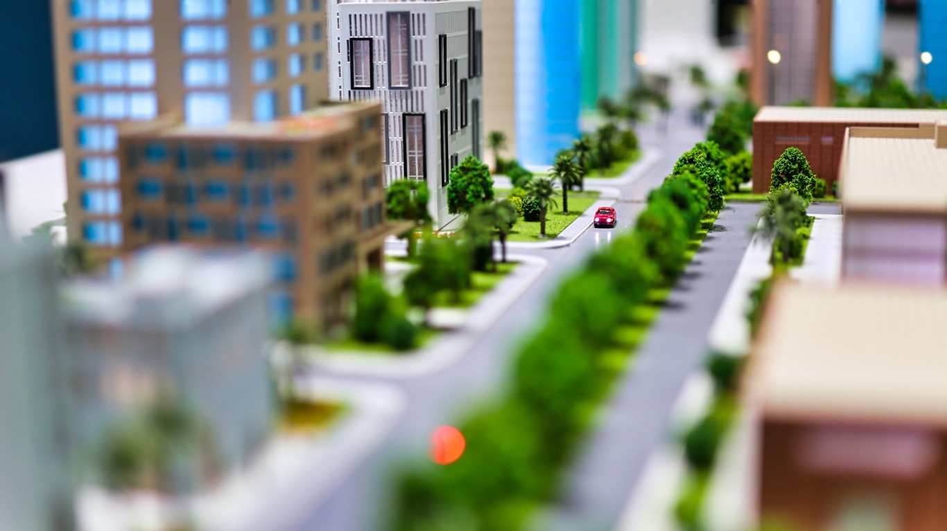 architectural model of a street with huge buildings and trees