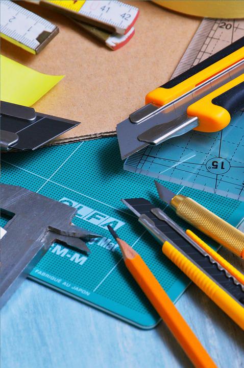blades and rulers on a cutting mat