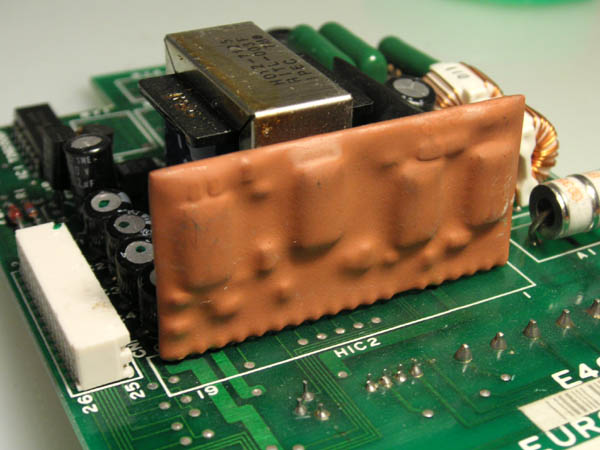 an epoxy encapsulated hybrid circuit on a printed circuit board