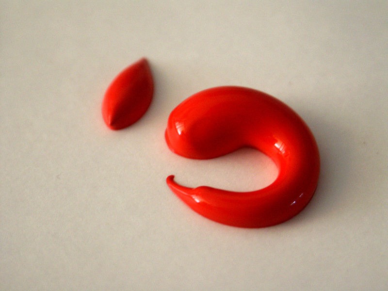 Red acrylic paint squeezed from the tube
