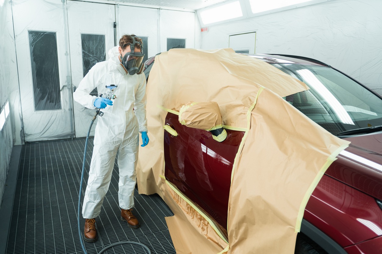 Man Painting a Car