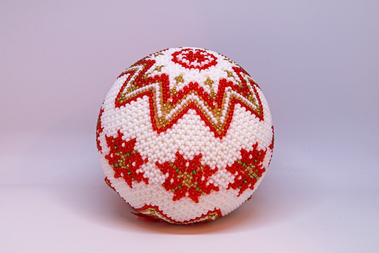 Christmas ball made of styrofoam and hand decorated with small glass pearls