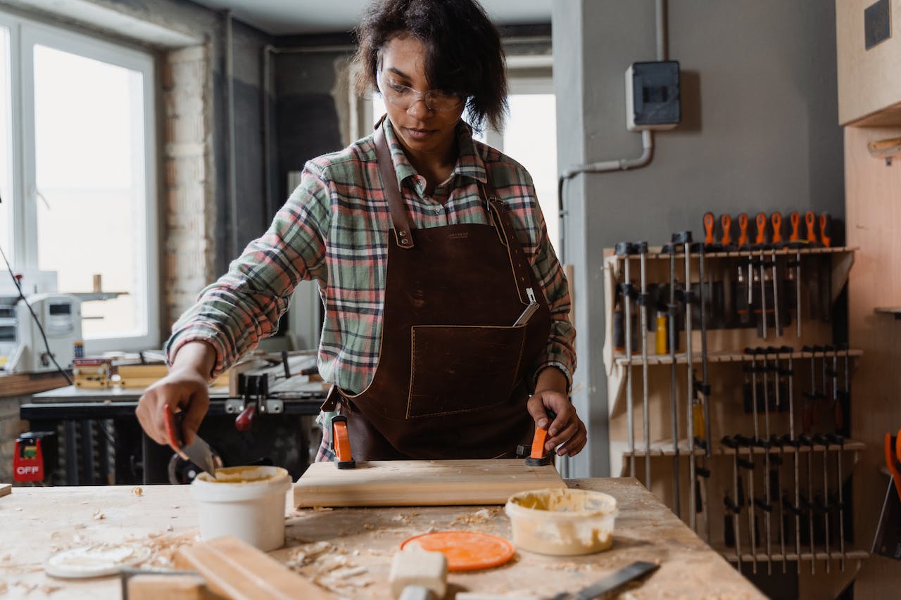 woman-gluing wood for kitchen