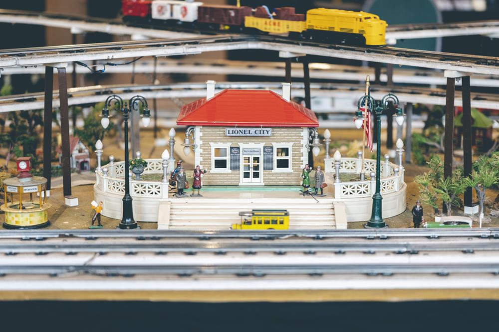 Colorful toy train city model with small figures and details