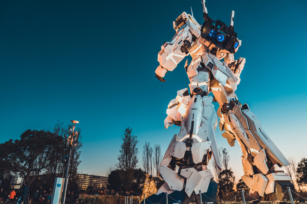 Rear view of life-sized Unicorn Gundam statue display at Diver City shopping center in Odaiba, Tokyo. Japanese tourist attraction landmark concept
