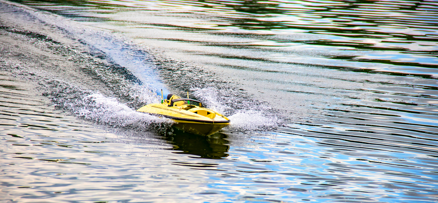 Remote-controlled model of racing boat in action