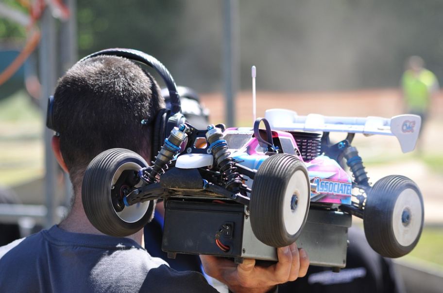 a person holding his RC buggy